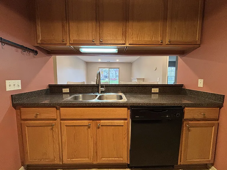 Open to the living room with a breakfast bar