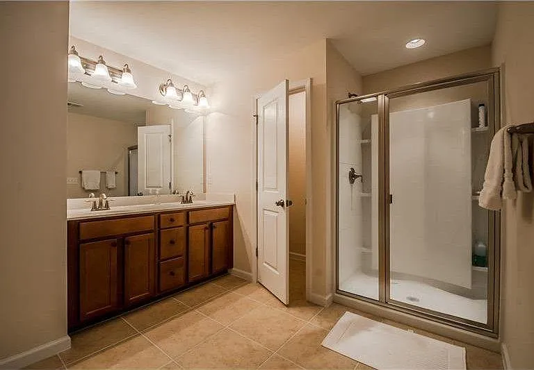 master bath with a huge walk in closet