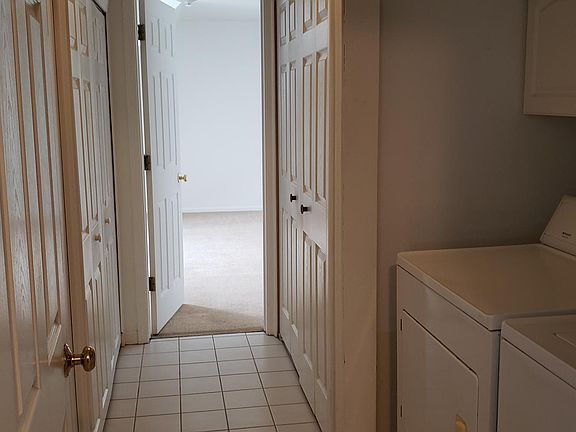 Laundry area with additional storage areas