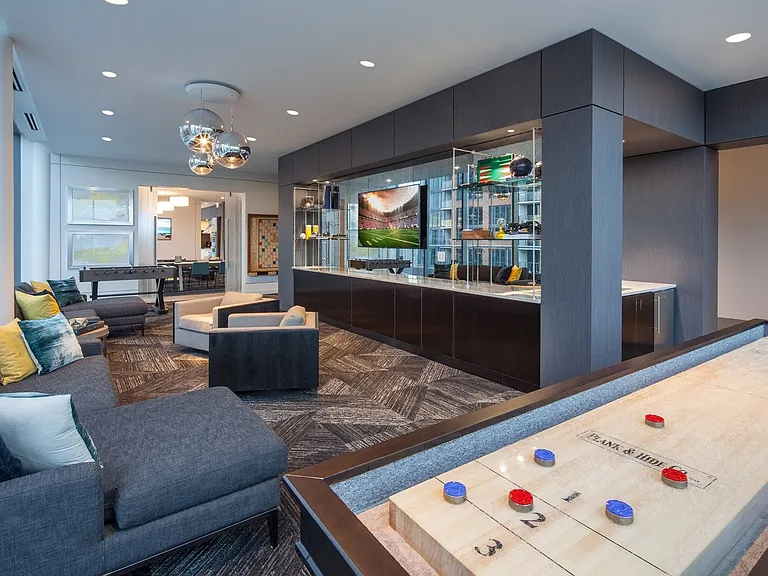 Game room featuring shuffleboard, billiards, foosball, giant scrabble and TV