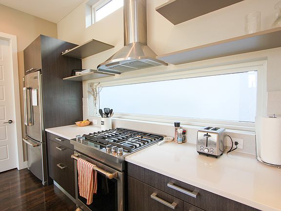The kitchen, gas range, double oven fridge, microwave, dishwasher, kitchen essentials, and pantry are all included.