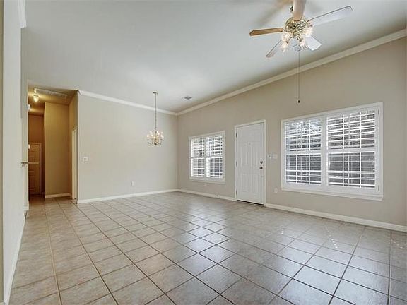 Spacious living/dining area features hard tile floors