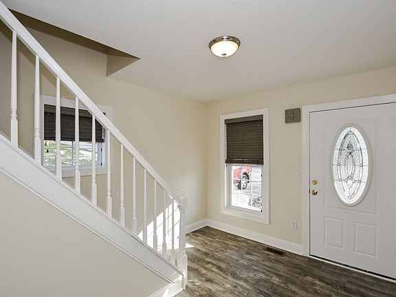 Entry with new doors, all new windows throughout, new composite flooring.