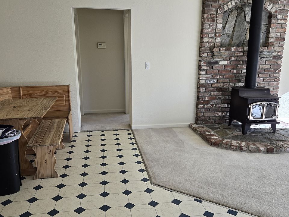 From Kitchen to dining nook and hallway to 2 bedrooms, woodburning stove