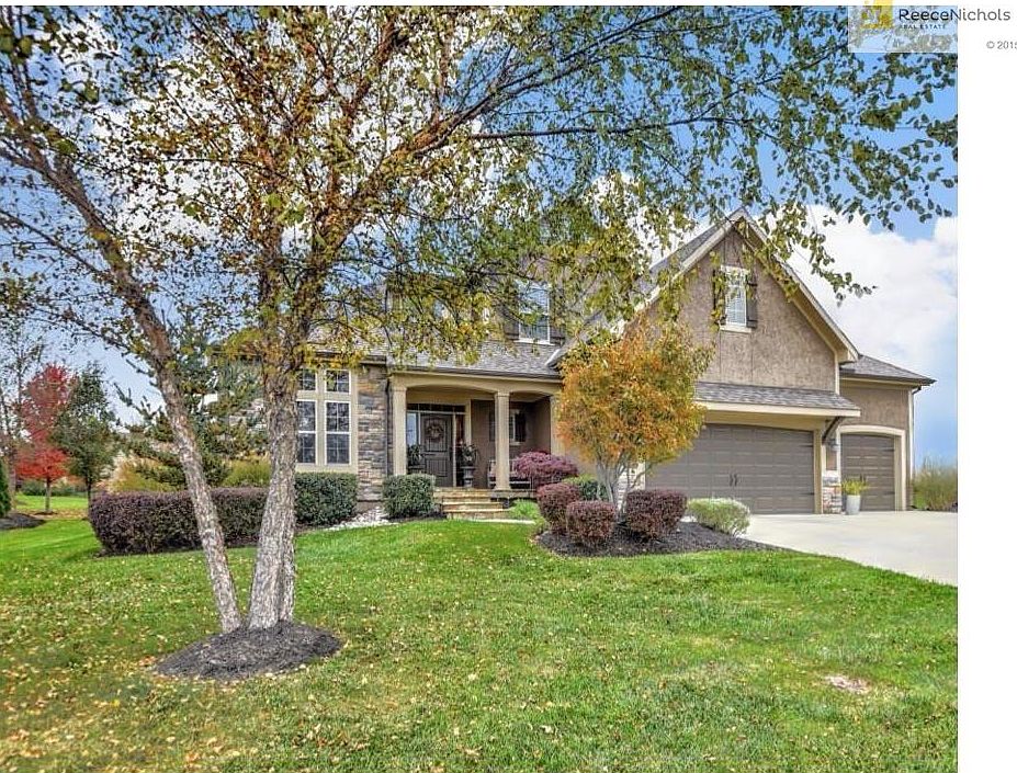 Beautifully appointed landscaping and evening uplighting welcomes you home.