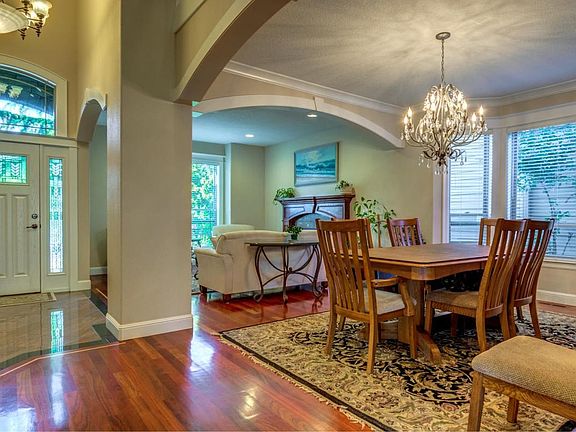 Entry hall, formal living and dining room.