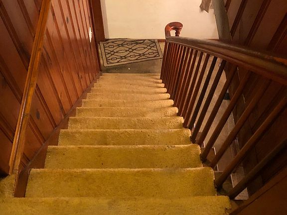 Steps to upstairs bedrooms and bathroom