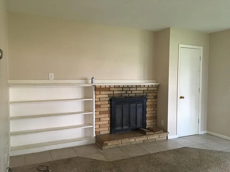 Fireplace with built in shelves
