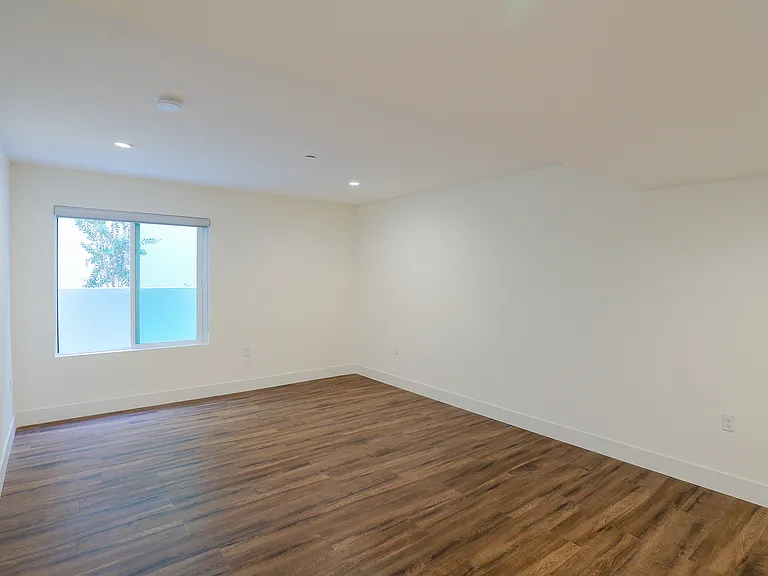 Bedroom with Recessed Lighting, Vinyl Flooring, and Windows