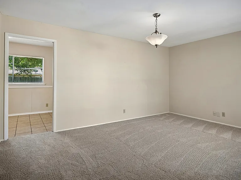 View from the living area to the kitchen entrance.