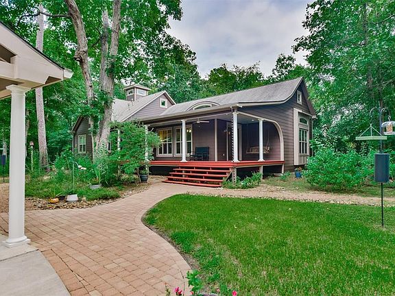 Retreat from the busyness of life to the huge private front porch hidden from the street. This custom one owner home was built with the environment in mind, keeping the surroundings as natural as possible.