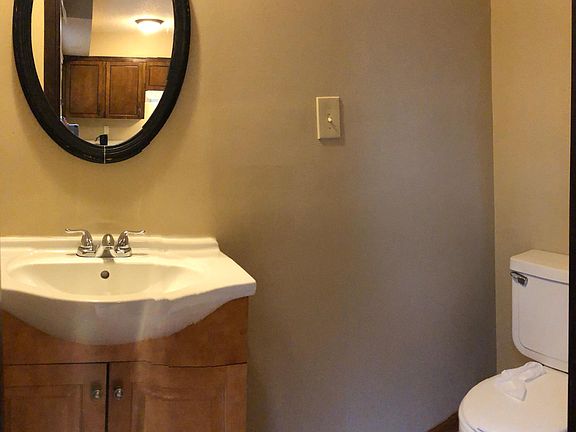 Powder room bathroom is on the main level just off the kitchen.