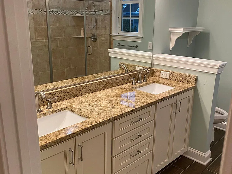 Double sink with granite counter top.