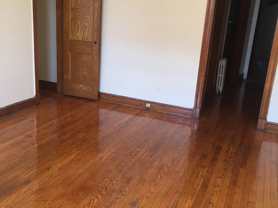 Harwood floors in living room with walk in closet