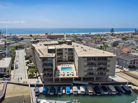 Corner unit on left bottom, Ocean & pier are behind building.