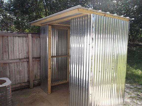 NEW SHED FOR WASHER DRYER ON BACK PORCH
