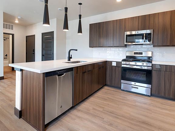 Kitchen with Quartz Countertops and Stainless Steel Appliances