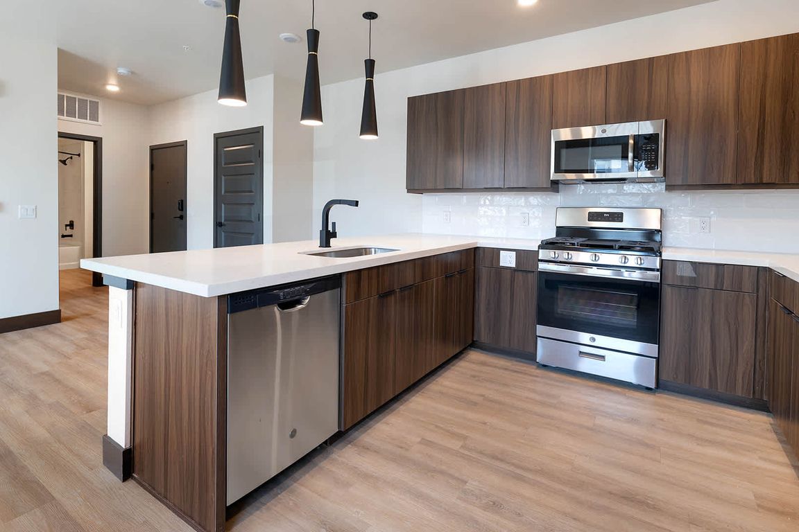 Kitchen with Quartz Countertops and Stainless Steel Appliances