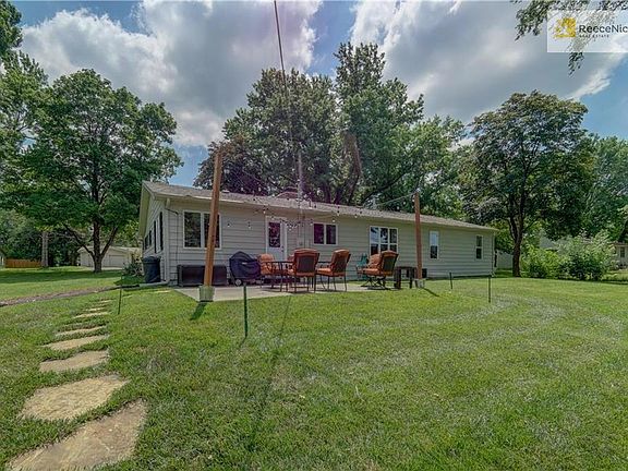 Large backyard with new concrete patio.