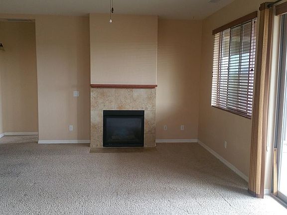 living/family room with gas fireplace with sliding glass door to rear porch