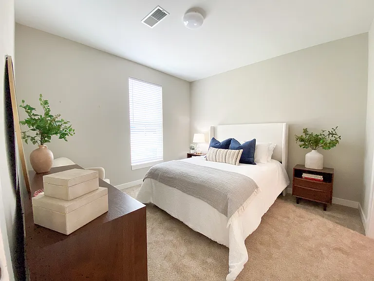 A calm, comfortable bedroom with space to unplug and recharge. A calm, comfortable bedroom with space to unplug and recharge.