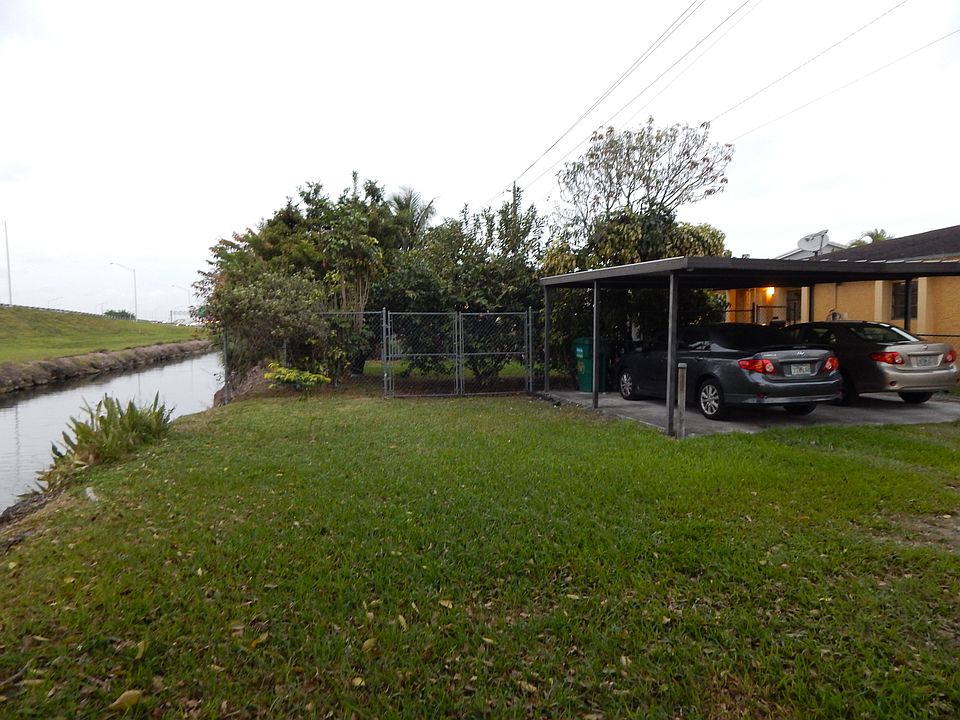 Front yard with covered parking
