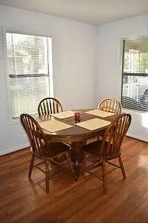 Dining room. Color of floor is now different, has recently been refinished to a darker color