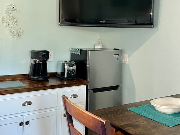 50" TV, 4' fridge and freezer, coffee maker and toaster oven, ample storage