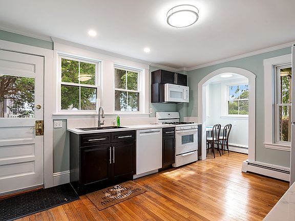 Spacious kitchen with all the essentials for your cooking needs, with views of the boat channel!