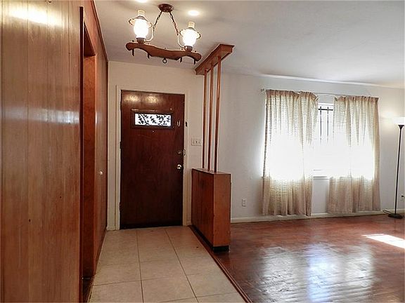 Wide open floor plan with wood and tile flooring. Easy to take care of and maintain!