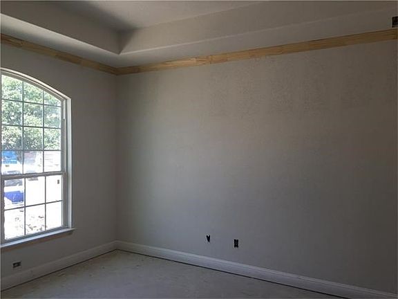 Massive front study! Perfect for a home office, craft room or even formal dining space. Nice tray ceiling detail.