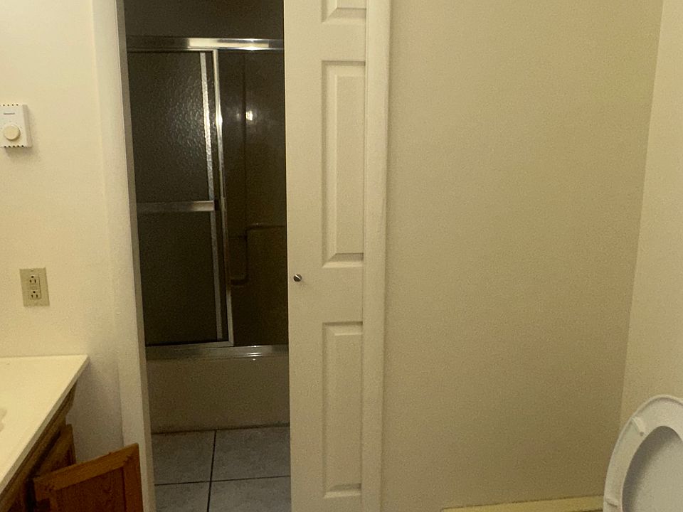 bathroom connects to master bedroom with dividing door for privacy