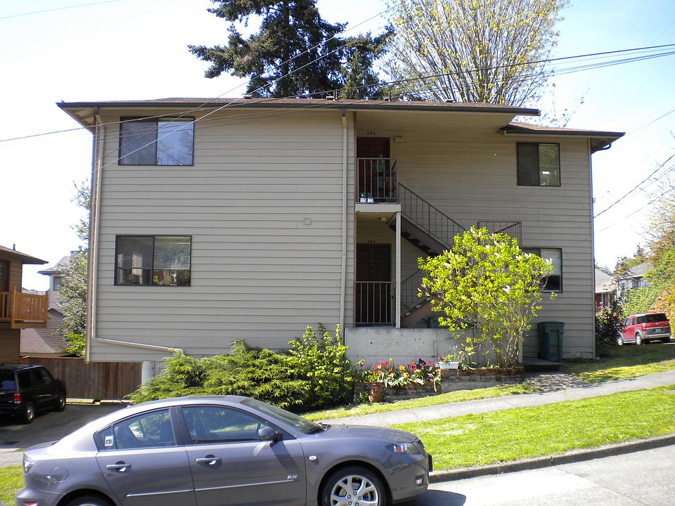 Exterior, facing west; off-street parking area to the left.