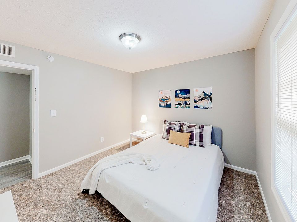 Spacious bedroom featuring a queen bed, nightstand, dresser and reach-in closet.