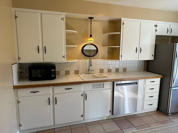Newer stainless steel appliances and gas stove.