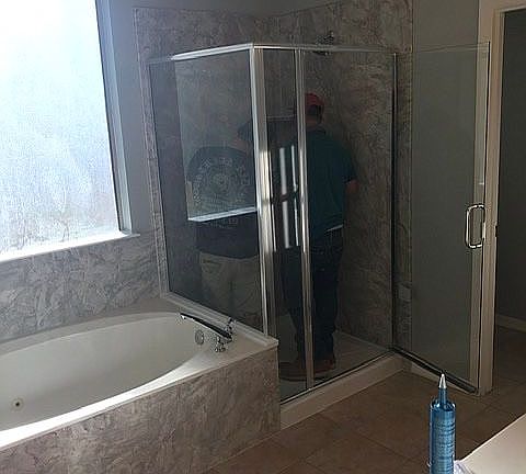 Enlarged shower surround