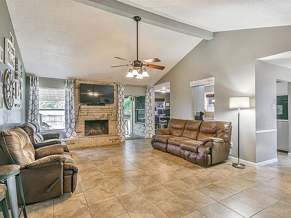 The living room is open to the dining room allowing plenty of space for entertaining