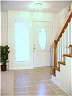Nice and bright foyer entry. Stairs lead to two bedrooms and guest bath.
