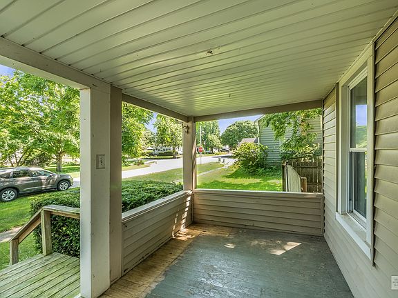 Can you imagine having your morning coffee on this porch?!