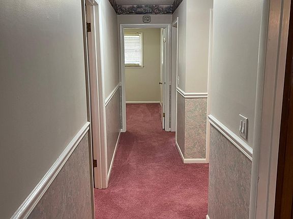 Hallway to 3 bedrooms and 1 and 1/2 baths