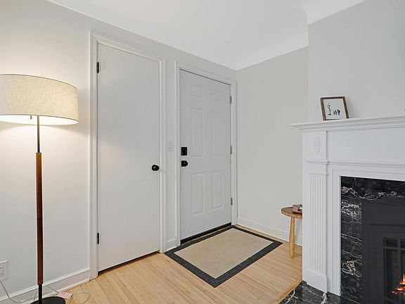 Front Door with Coat Closet and Gas Fireplace