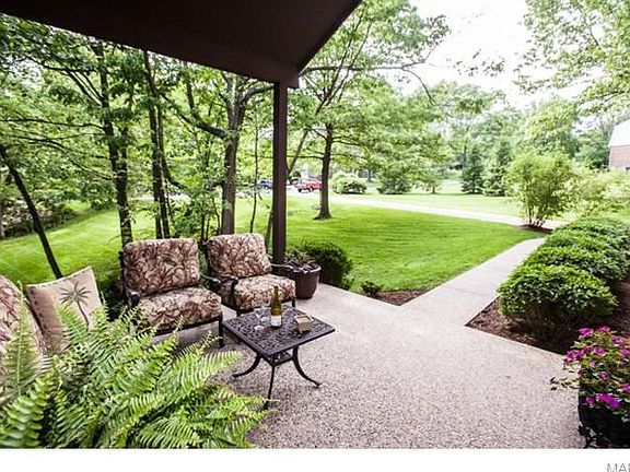 Covered front porch with serene view for relaxing!