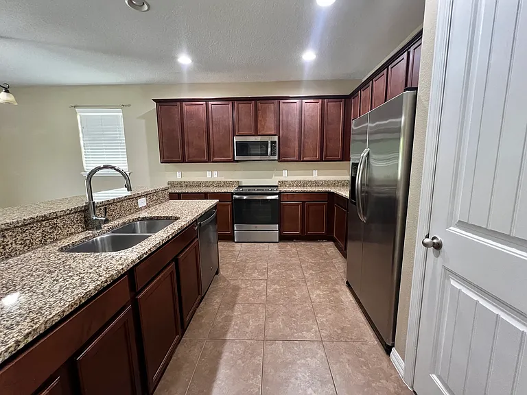 STAINLESS STEEL APPLIANCES AND PLENTY OF COUNTERSPACE AND 42" CABINETS, REFRIGERATOR, DISHWASHER, MICROWAVE & STOVE INCLUDED.