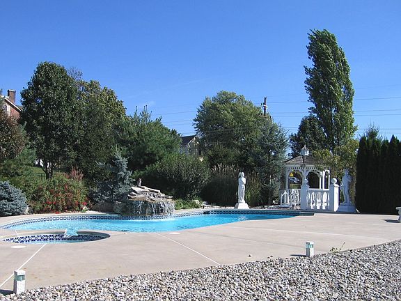 Feel invigorated when taking a dip in the extravagant 42 x 27 ft heated pool.