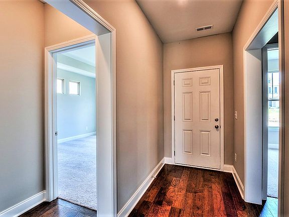 Foyer connecting to masterbedroom and designated office space.