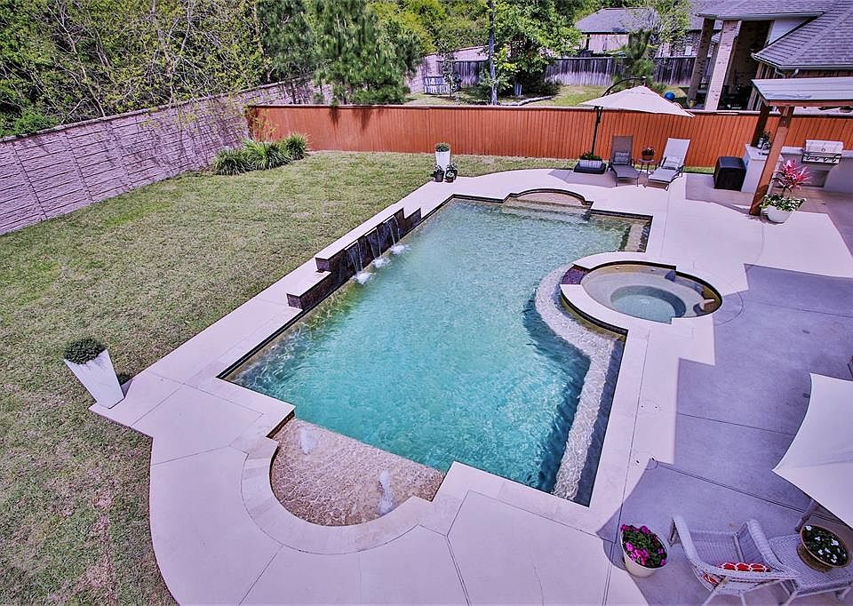 Large pool with triple sheer waterfalls, several kid fountains, sun shelf, sitting benches, heated spa. Perfect to relax in, or swim laps your choice!