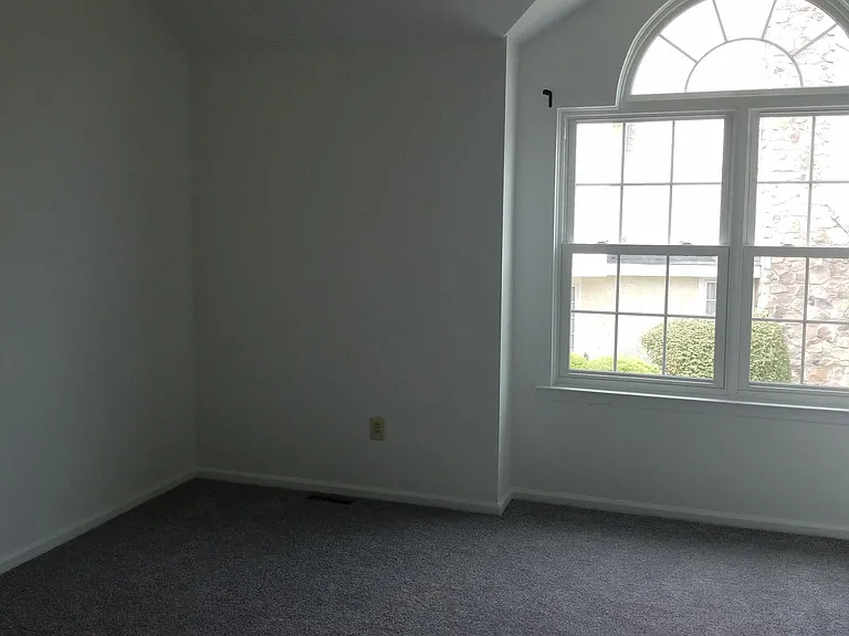 Master bedroom with vaulted ceilings.