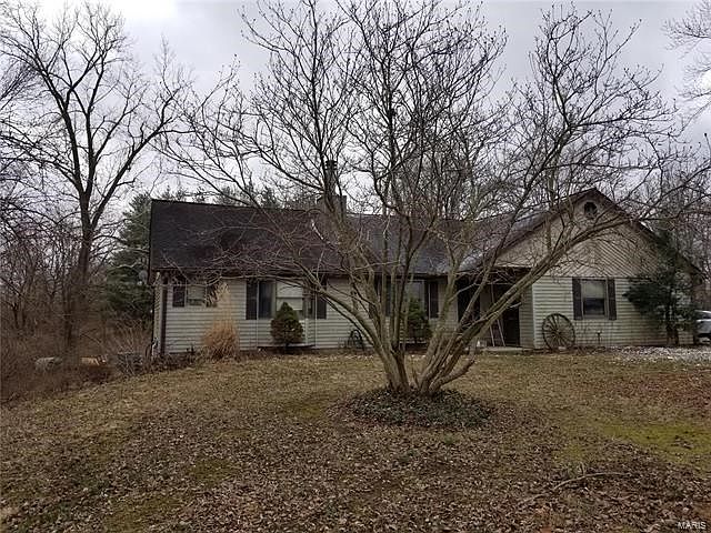 9.52 Acres with Home, Lake & Out building