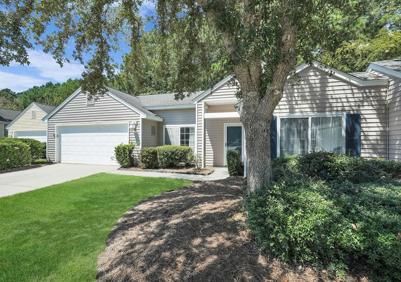 "Charming 2-Bed Oasis with 2 Full Baths, Den and Screened Patio on Huquenin Lane in Sun City!" — Photo 1