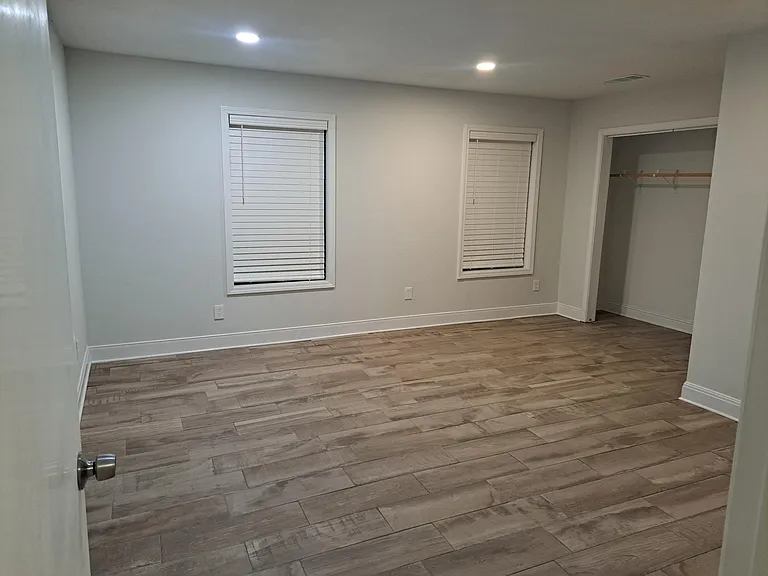 Large master suite with 3 windows and large closet. All new wooden mini blinds furnished.